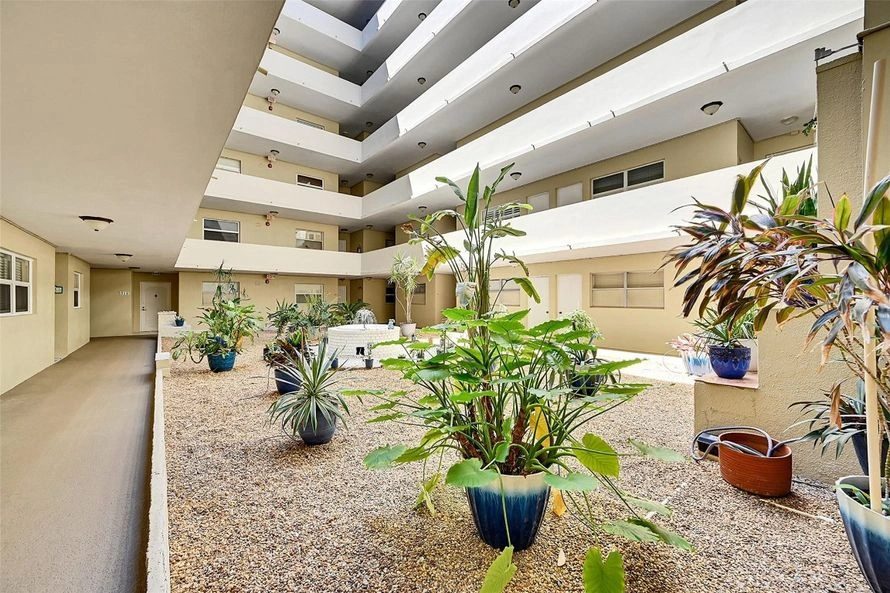 The open planted courtyard running through the middle of the building.